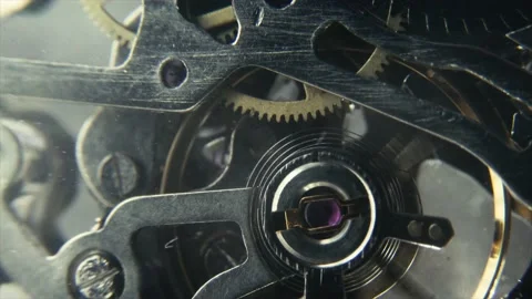 4k macro clip of mechanical gear spinning inside a wrist watch Stock Footage 233655609