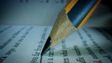 4k Macro Close-up Through a Book with a Pencil Highlighting  Stock Footage 106658062