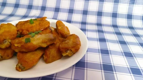 4K macro close up view of vibrant crispy hot fried chicken wings with slice.. Stock Footage 318252775