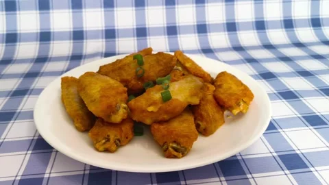 4K macro close up view of vibrant crispy hot fried chicken wings with slice.. Stock Footage 318252813