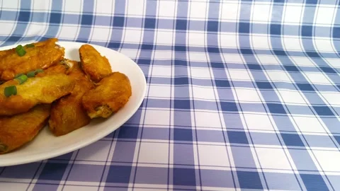 4K macro close up view of vibrant crispy hot fried chicken wings with slice.. Stock Footage 318252941