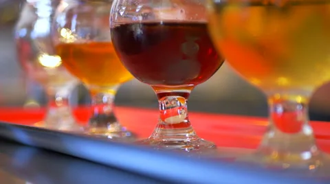 4K Macro Shot of Hand Grabbing Beer Glass, Beer Flight Tasting Close Up Stock Footage 67468040