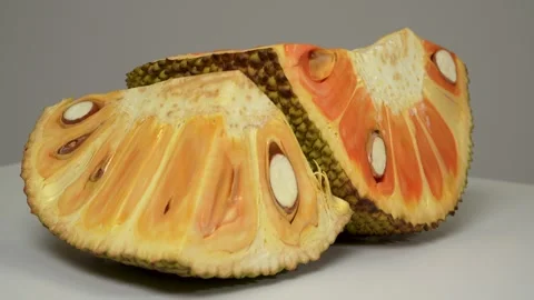 4K Macro of a Sliced Orange Jackfruit, Revealing Vibrant Pulp and Seeds. Stock Footage 316536726