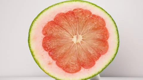 4K Macro Top-Down View of a Sliced Red Pomelo Fruit Revealing its Texture. Stock-Footage 316953283