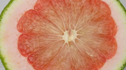 4K Macro Top-Down View of a Sliced Red Pomelo Fruit Revealing its Texture. Stock Footage 316953299