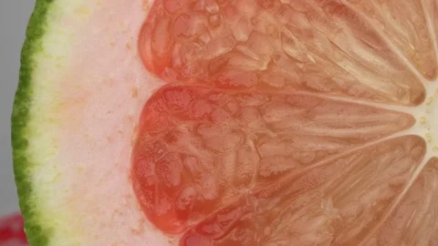 4K Macro Top-Down View of a Sliced Red Pomelo Fruit Revealing its Texture. Stock Footage 316953459