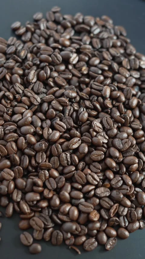 4K macro video of roasted coffee beans texture. Video stock 329593488