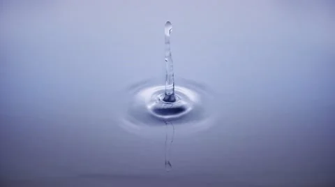 4K Macro water drop in slow motion - clear blue (H264) Stock Footage 54749213