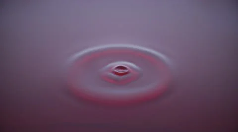 4K Macro water drop in slow motion - ruby red (H264) Stock Footage 54786769