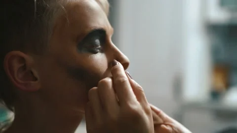 4K Make UP artist applying make up to child's face as part of Halloween costume Stock-Footage 142455164