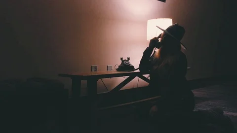 4K Making The Call - Retro Stylish Woman With Hat Using Old Phone (Silhouette) Video stock 116661055
