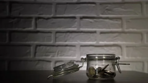 4K. Male hand close-up, throws coins, euros in the piggy Bank. Stock Footage 131348564