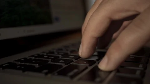 4K Male Programmer typing on laptop keys, writing code or hacking concept Stock Footage 106429160