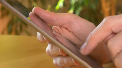 4k male using tablet pc ipad tracking shot reading writing technology online Video stock 57310423