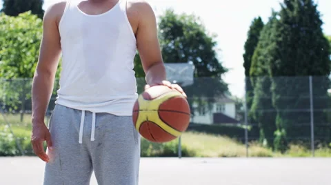 4K Man with basketball takes a free throw, in slow motion, with space for text Stock Footage