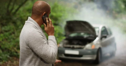 4k, A man calling roadside assistance for help with his car trouble. Stock Footage