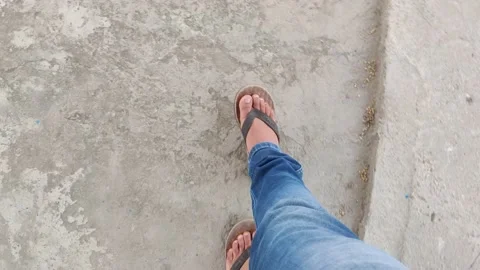 4K A man capturing video of his walking foots Stock Footage 154484856