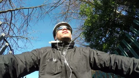 4K Man cycling along a path in the daytime Stock Footage 71546916