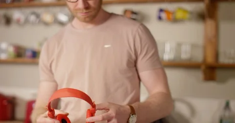 4k Man dancing to music that is playing on his headphones  Stock Footage 128408007