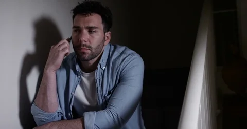 4K Man in a deep depression making a phone call for help but getting no reply Stock Footage 79845301