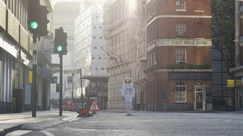 4K Man dressed as astronaut walking through London street in morning - EDITORIAL Stock Footage 72607444