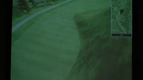 4K man drives golf ball into simulator and hits the fairway Stock Footage