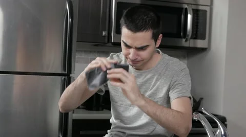 4K Man with Empty Wallet in Home Kitchen Stock Footage 61084168