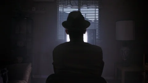 4K Man in hat sits in front of Static Vintage TV Video stock 93405224