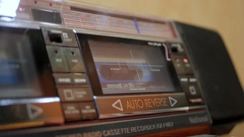 4K man inserts an audio cassette into a retro radio and turns on play Stock Footage 262479664