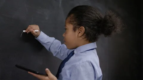 4K Man &amp; little boy with tablet computer writing math sum on blackboard Stock Footage 59744598