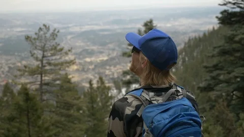 4K Man Looking Out Over View in Colorado Mountains Video stock 105328832