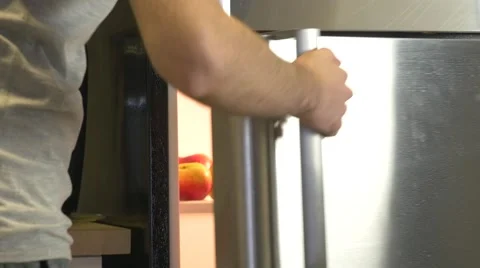 4K Man Picking Up an Apple Stockbeeldmateriaal 50569919