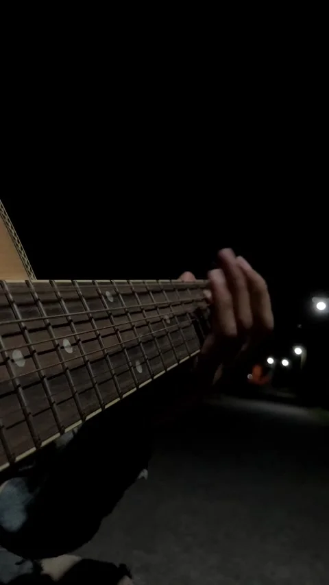 4K Of Man Playing Guitar Focus On Neck And Left Hand Slow Motion Stockbeeldmateriaal 337223559