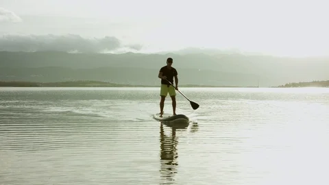 4K Man Practising StandUp Paddle Boarding  Stock Footage 93077059