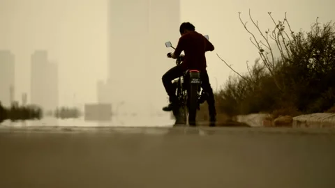 4K Man Riding Motorcycle Stock Footage 141669586