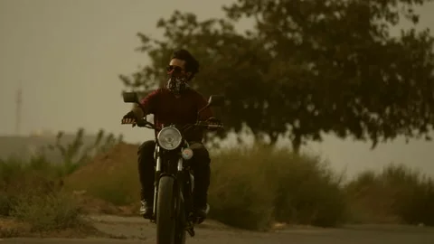 4K Man Riding Motorcycle Stock Footage 141670111