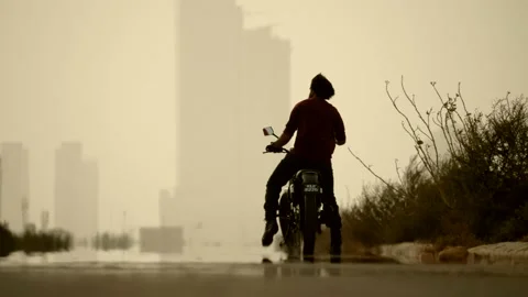 4K Man Riding Motorcycle Stock Footage 141670126