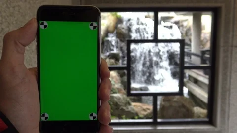 4K Man show the Green Screen phone in Chinese Garden, window traditional-Dan Stock Footage 86093277