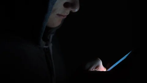 4K Man on a smart phone with light on face, hoodie teen with dark black Vidéo 90795677