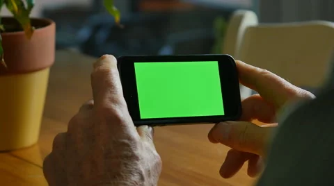 4K MAN WITH SMARTPHONE GREENSCREEN Stock Footage 45203287