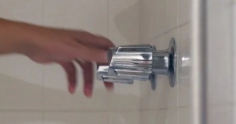 4k Man starts shower Stock Footage 94358701