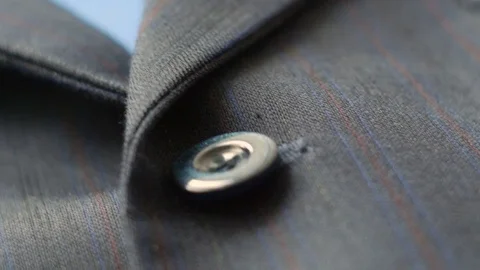 4k of man suit jacket close up to buttons. Dolly shot Video stock 77569774