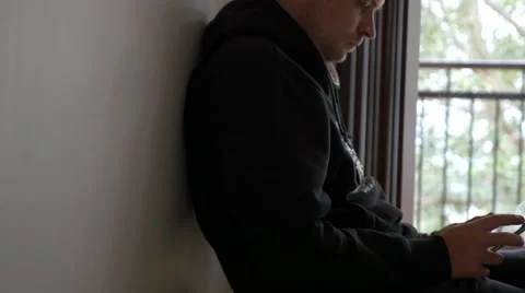 4k Man on Tablet by Window Stock Footage 40283356