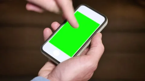 4K Man Taps Greenscreen Smartphone with Tracking Points Stock Footage 43220651