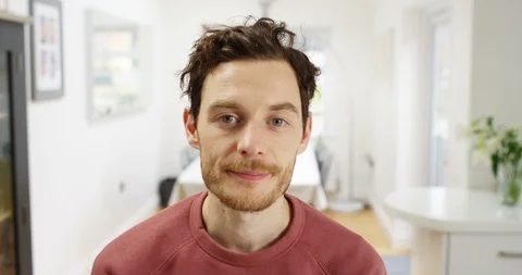 4K Man trying to look interested, listening to boring conversation on video call Video stock 88542952