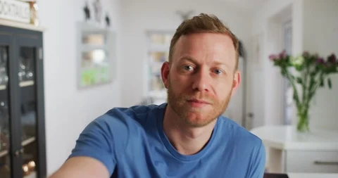 4K Man trying to look interested, listening to boring conversation on video call Stock Footage 108120410