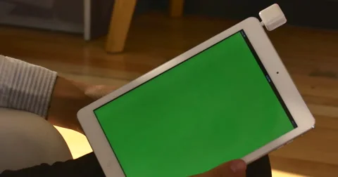 4K Man uses Tablet Computer Green chroma-key Screen Swiping Credit Card Payment  Stock Footage 51054612