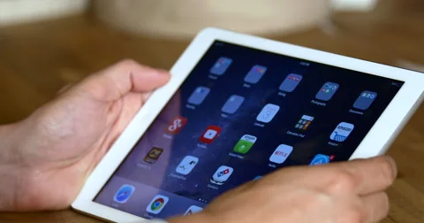 4K Man Using Tablet Computer Close-Up scrolling through icons Stock Footage 51054745