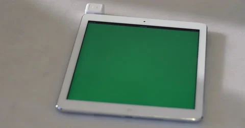 4K Man Using Tablet Green chroma-key Screen Swiping Credit Card Payment Square Stock Footage 51054887