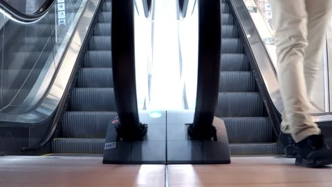 4K. Man walking down from modern escalator stairs 動画素材 91007620
